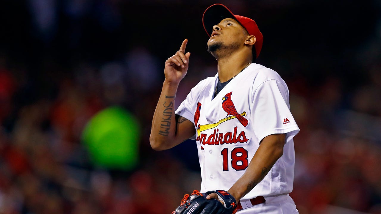 Martinez pitches a gem, Holliday hits emotional home run